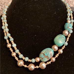 Two strand necklace with gold tone beads. turquoise howlite and clasp.  New